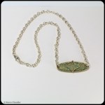 bronze oval layered pendant, blue patina